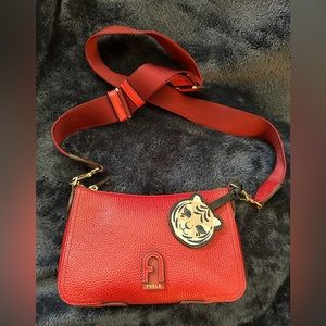 Furla Red Leather Atena crossbody bag with tiger pendant